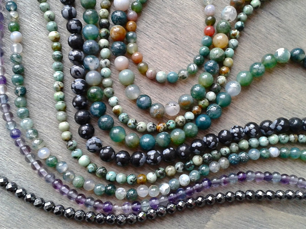 Strands of gemstone beads in many sizes and shapes
