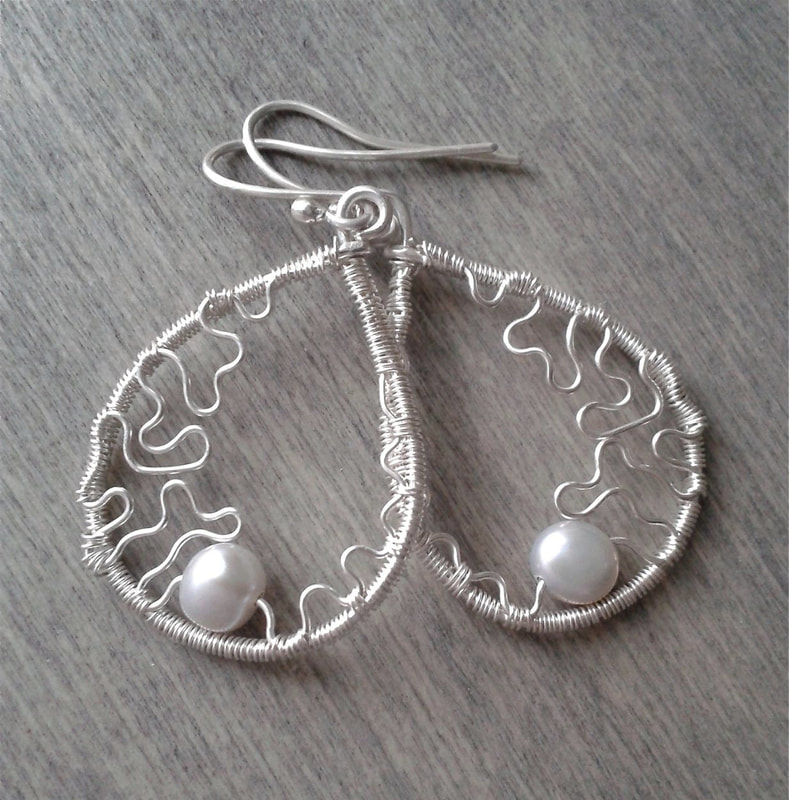 Sterling silver dangle earrings with freshwater pearls